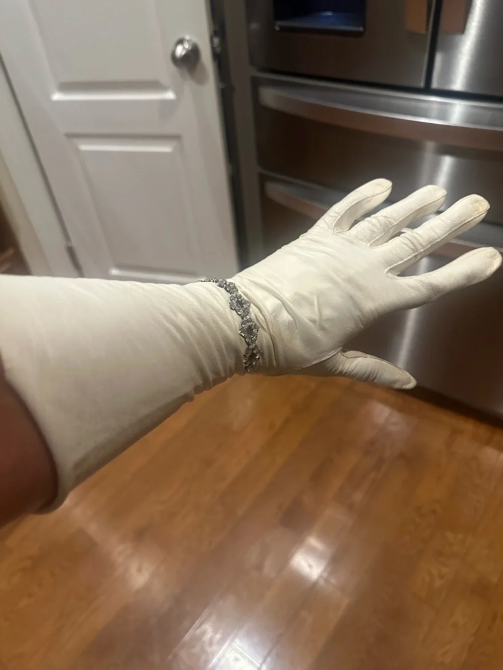 Vintage White‎ long Gloves with decorative rhinestone accents at the wrist.